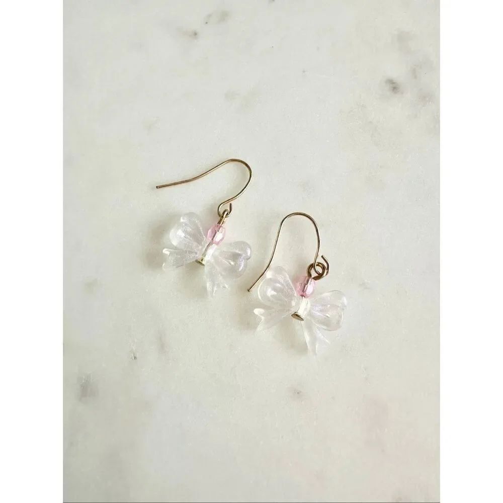Dainty bow dangle earringsβwith light pink